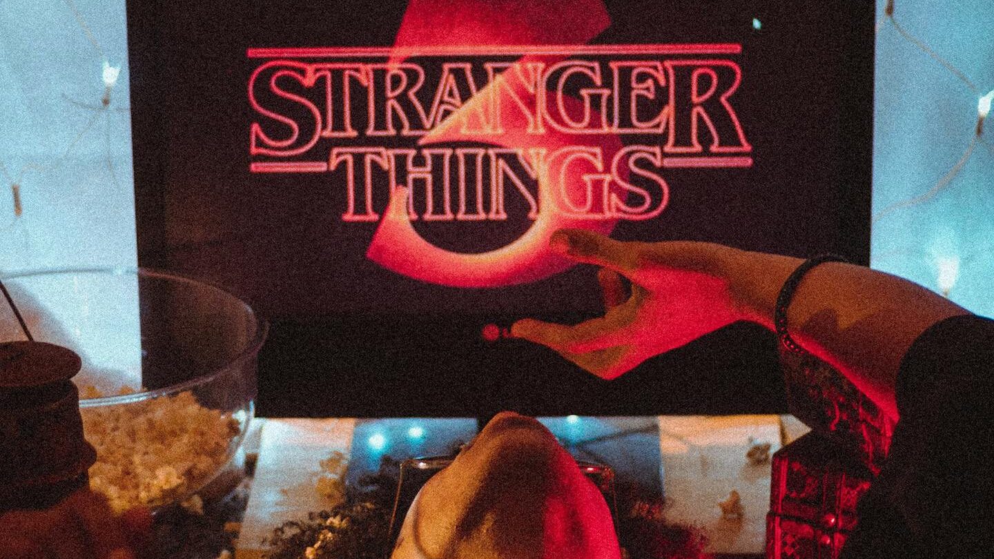 Relaxing under a blanket fort with popcorn and Stranger Things playing. Perfect for movie night ambiance.